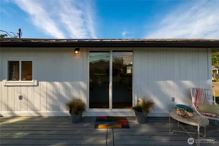 The large evergreen provides a touch of afternoon shade to keep the house and the guest cool.