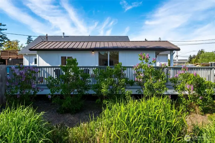 Enjoy the lilac bushes that surround your deck.