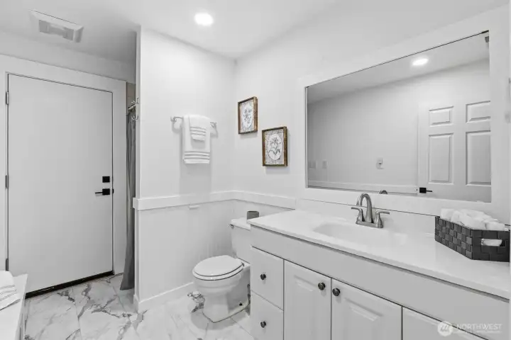 Lower Level Bathroom with New Floors and paint