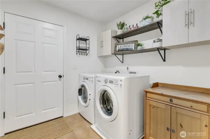 Main floor laundry near primary suite for convenience. Connects to spacious 2 car garage. Main floor laundry near primary suite for convenience. Connects to spacious 2 car garage.