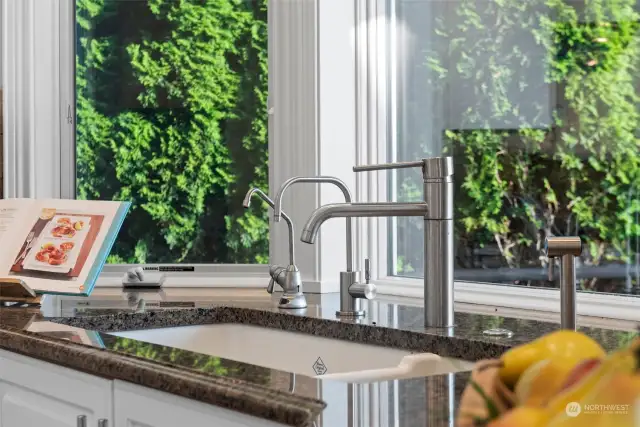 This attention to detail allows you to enjoy the serene outdoors while performing daily tasks, making kitchen chores more pleasant. The window’s placement not only provides a picturesque backdrop but also floods the space with natural light, enhancing both the aesthetics and ambiance of the kitchen.