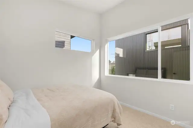 Wake up refreshed in this bright, airy bedroom, that offers peace and privacy with plush comforts and modern aesthetics.