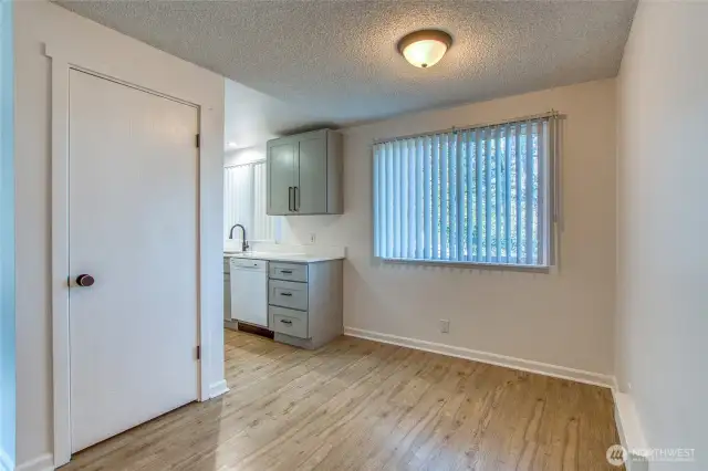 The living room leads into the eating area with a large pantry.