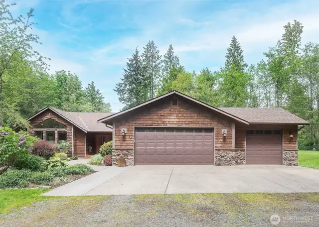 One level home, three car garage on 5 acres with complete privacy.