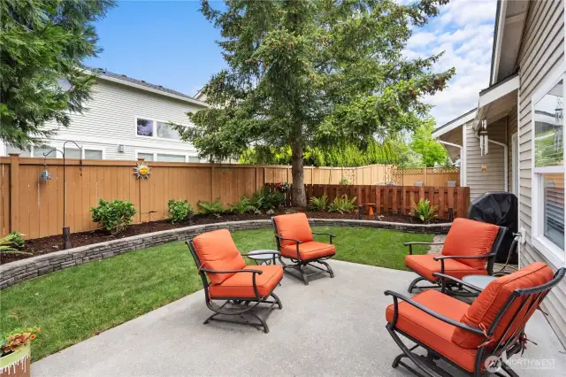 Meticulously landscaped and fully fenced for both beauty and privacy