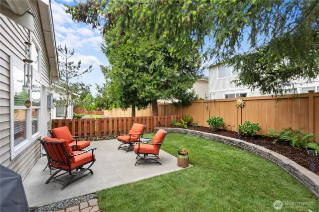 Meticulously landscaped and fully fenced for both beauty and privacy