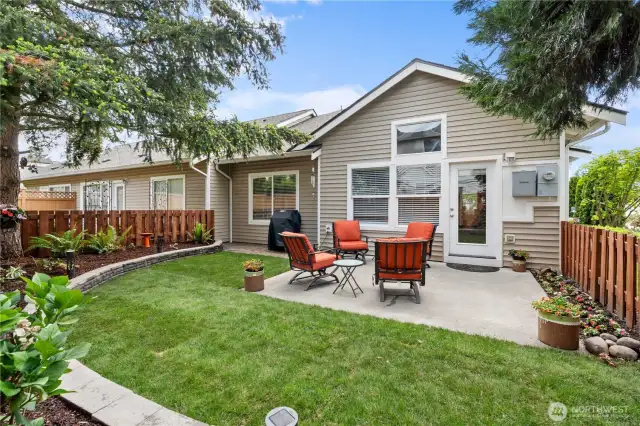 Meticulously landscaped and fully fenced for both beauty and privacy
