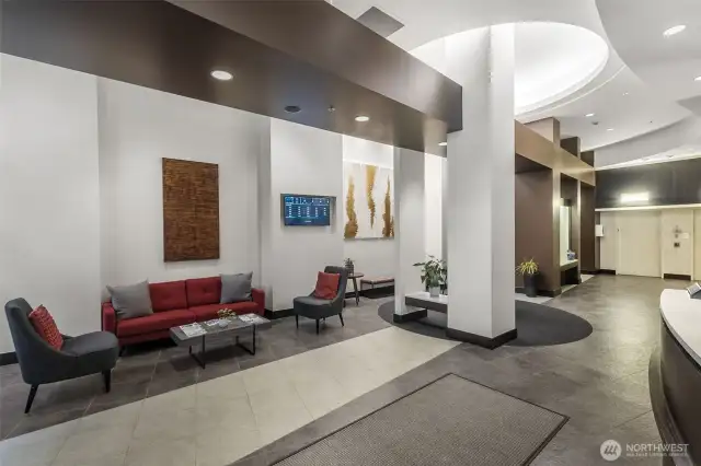 Step into style. The Vine’s sleek, modern lobby with 24/7 concierge sets the tone for elevated urban living in Belltown.