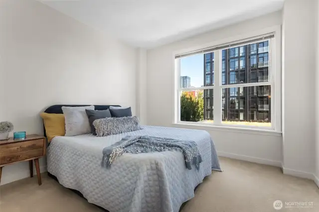 Spacious primary bedroom, your serene retreat offering comfort, light, and room to unwind.