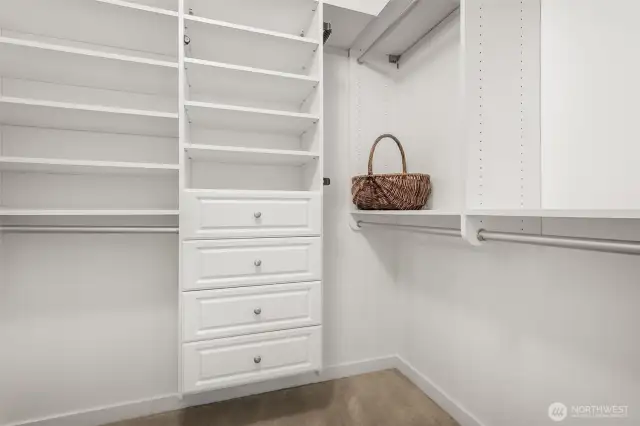 Organize in style, spacious walk-in closet in the primary bedroom, thoughtfully outfitted with California Closets built-ins for effortless storage.