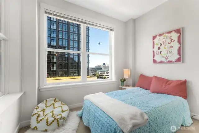 Versatile and bright. Bedroom #2 offers serene views of Elliott Bay, perfect as a restful retreat, guest room, or creative space.