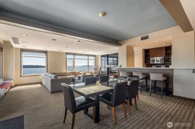 Entertain in style! The Vine’s owner's lounge features a dining area, open-concept kitchen, cozy greatroom with fireplace and flat-screen TV, game space, and stunning views of Elliott Bay and the Seattle waterfront.