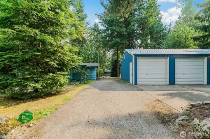 Large 3 car ( only 2 bays showing) garage/shop.