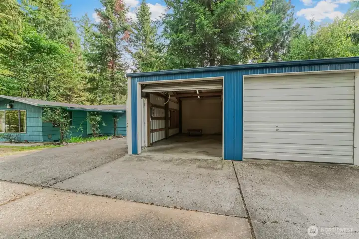 Home on left and partial view of the 3 bay garage/shop.