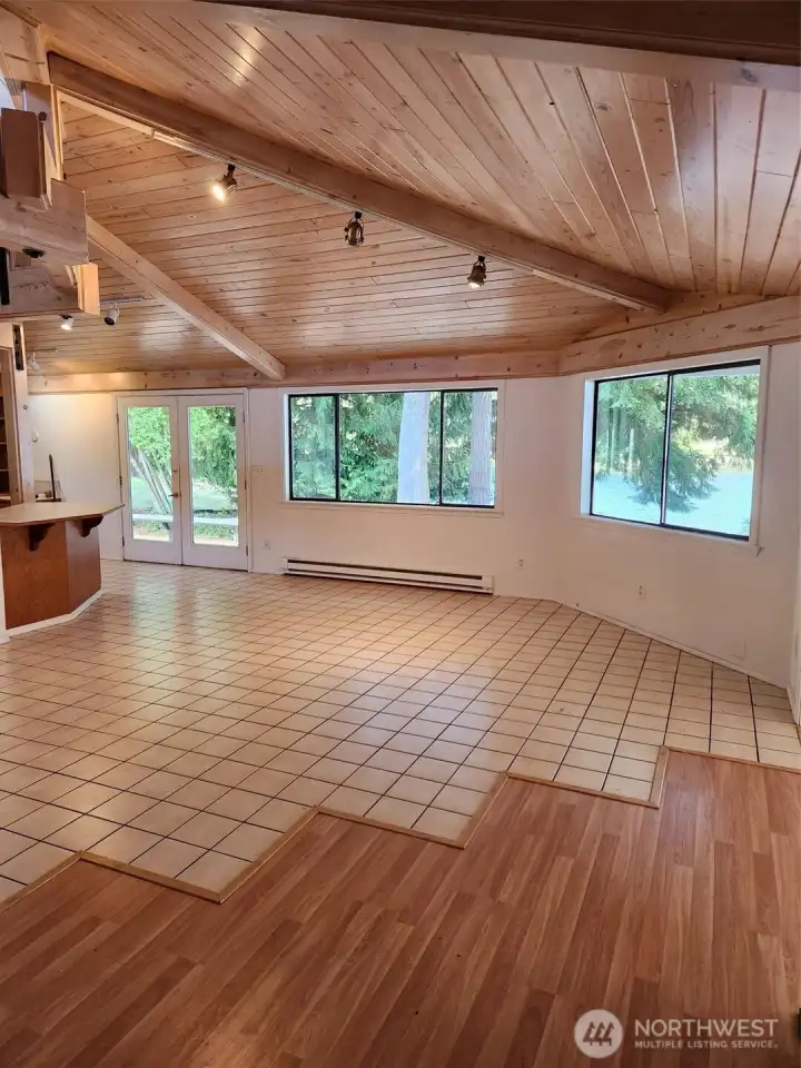 Tile and laminate floors. Cathedral ceilings with custom wood.
