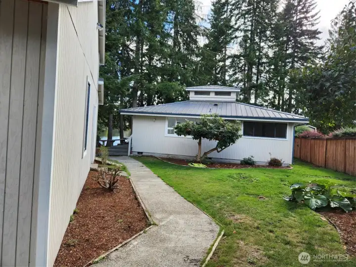 Sidewalk leading to front door.