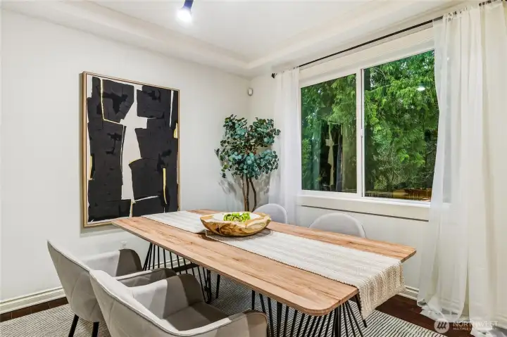 Formal dining room with ceiling detail and green views!