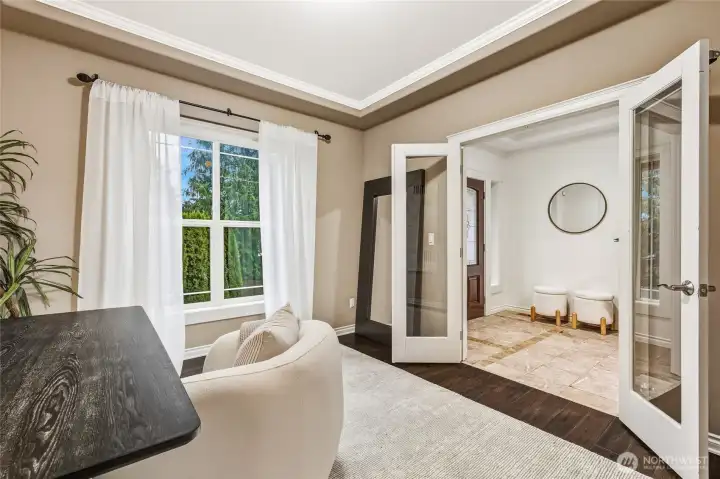 Elegant glass French doors into the main floor room.