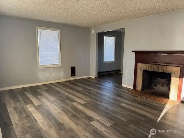 Newer flooring throughout living room and lots of natural light.