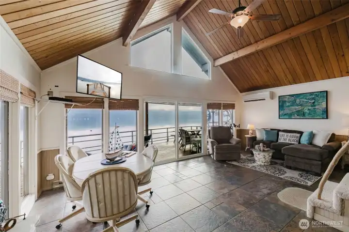 Dining and Living Area full of windows to the water