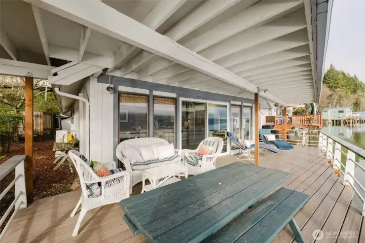 Large covered deck with new composition decking. Pleasant and enjoyable no matter the weather.