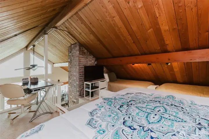 Loft bedroom looking out toward view...cloudy the day photos were taken.