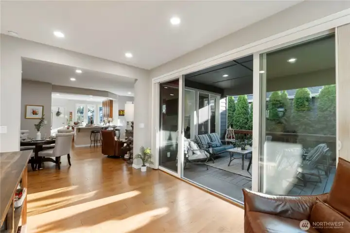 Large glass doors with large opening to the covered patio