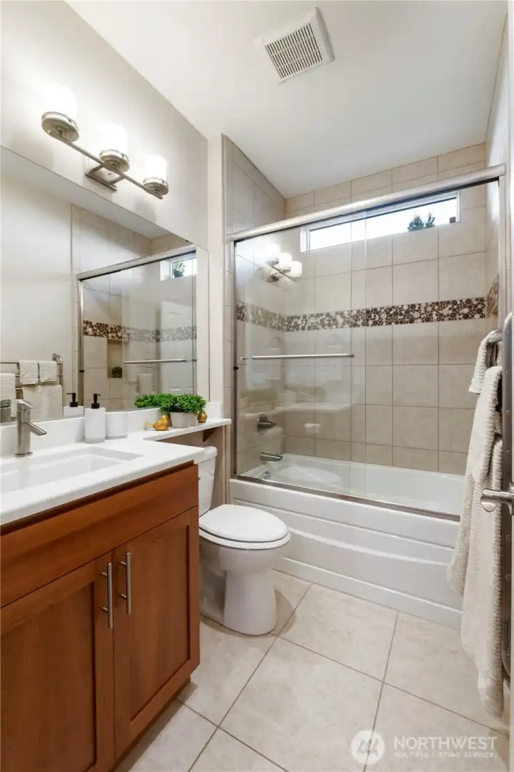 Hall full bathroom with heated towel rack