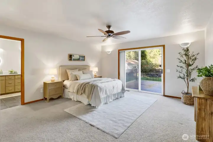 Primary bedroom with deck access.