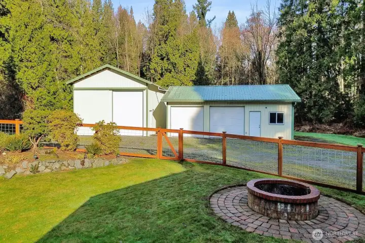 Outdoor fire pit to cook on or stay warm. Car and RV shop in back.