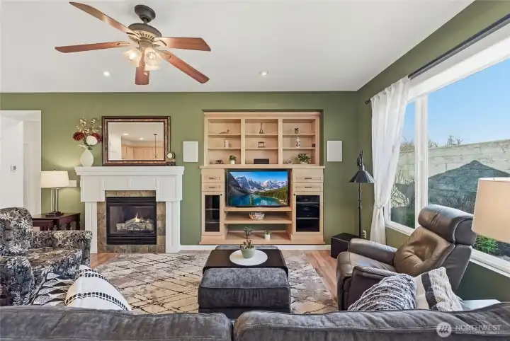 Gas fireplace w/custom mantle, built-in media center and         surround sound system.