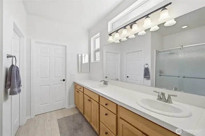 Primary Bath w/large walk-in closet, step-in shower dual sink vanity.