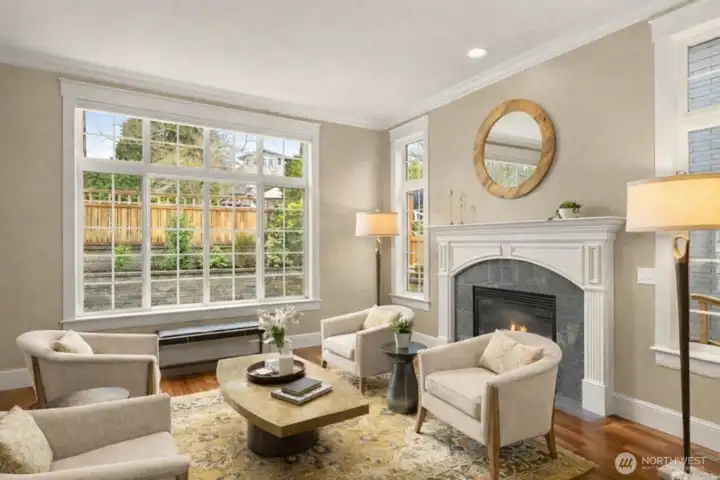 A wall of windows sets the tone for this charming formal living room.
