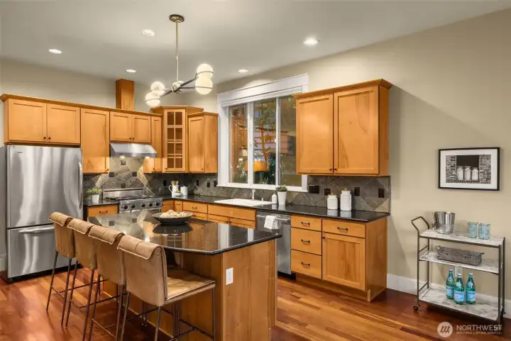 This kitchen is the true heart of this home.  Enjoy ample storage, stone counters & a Viking gas range.