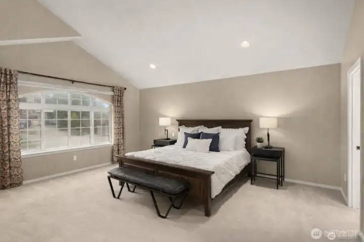 This expansive primary bedroom allows space to relax and unwind.  Hunter Douglas blinds are App controlled.