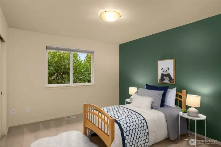 This is the 2nd bedroom on the top floor.  The closet has a custom-built storage system.