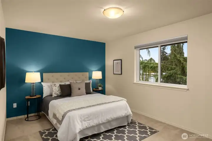 3rd spacious bedroom on the top floor.  This room also has a custom-built closet system and App controlled Hunter Douglas blinds.