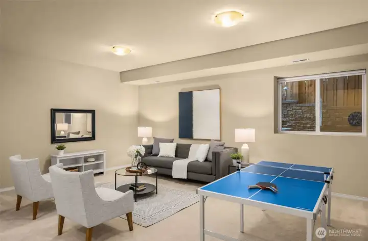 The lower-level features high ceilings, an expansive media room, a 5th bedroom, & full bathroom.