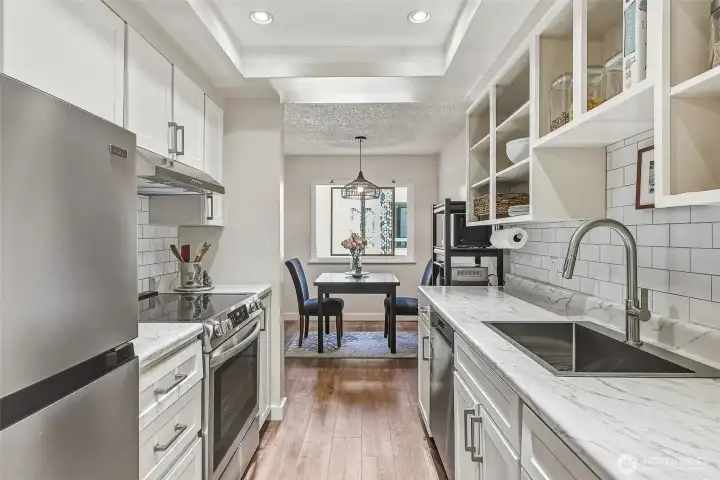 Updated galley kitchen looking towards the dining room.