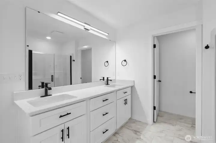 Primary suite vanity, toilet has its own space