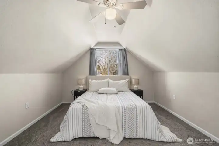 Primary bedroom on upper level with private bathroom.