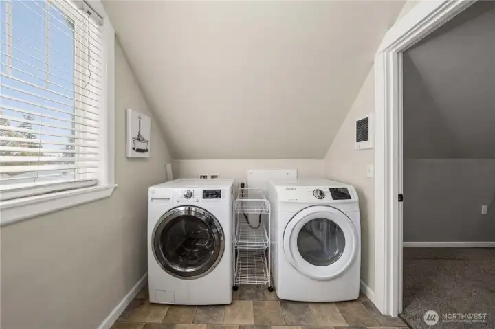 Upper level laundry space off primary bedroom.