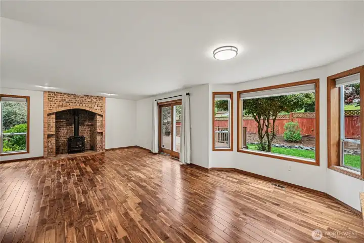 Bay windows enhance the natural light, and new interior paint adds a fresh, updated feel.