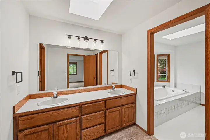 Enjoy a light-filled primary en-suite with a skylight and dual vanity—perfect for comfortable, everyday living.