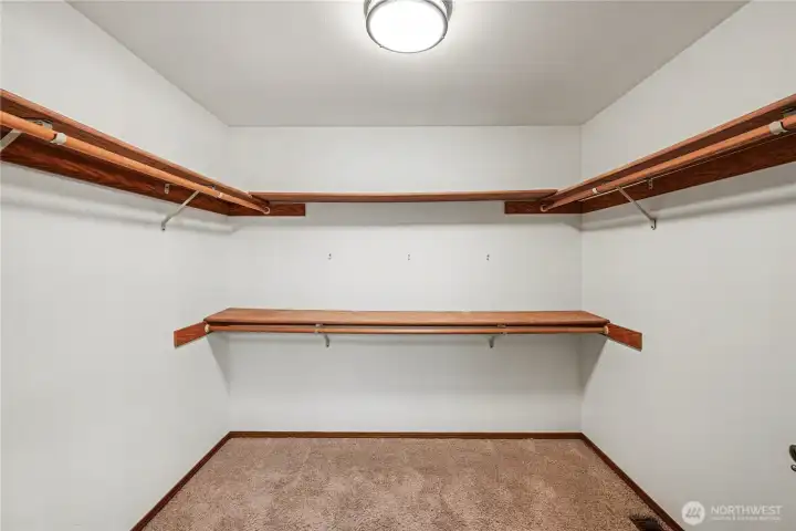 Generous walk-in closet offering ample storage and organization space.