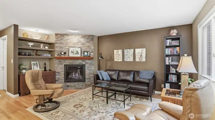 The family room is warm with hardwood floors and a special gas log fireplace.