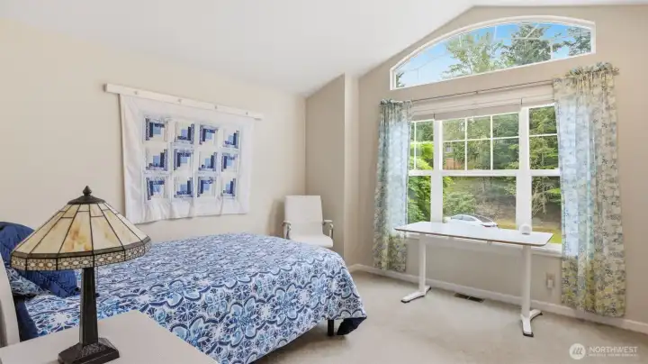 One of the 3 other bedroors with a vaulted ceiling and special ceiling feature