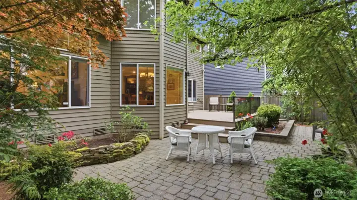 The backyard has been wonderfully made into gorgeous gardens.  A large Trex deck and a well designed cobblestone patio.  Fully fenced and a sprinkler system.