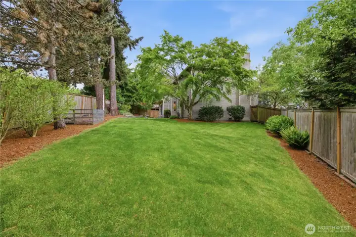 Large Backyard with Mature Landscaping and Garden Space