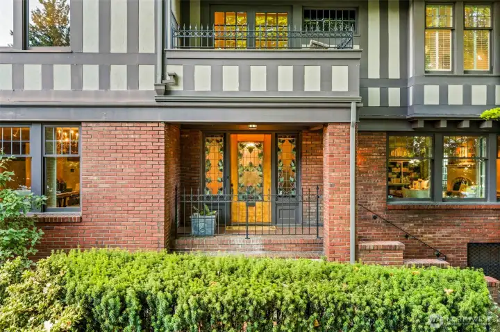 Handcrafted stained glass hints at the rich history and artistry waiting just beyond the threshold.